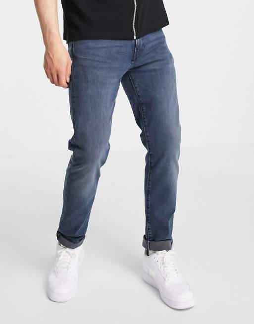 Levi s 512 slim tapered fit jeans in dark navy overdye