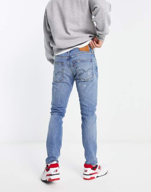 Levi's 512 slim tapered fit jeans in mid blue with destruction | ASOS