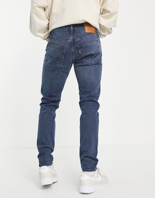 Levi's 512 slim taper jeans with distressing in light blue wash