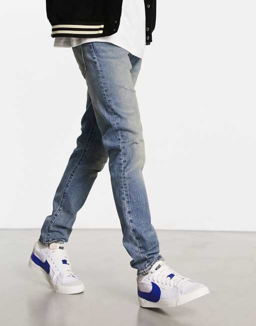 Levi s 512 slim tapered fit jeans in vintage blue wash with knee