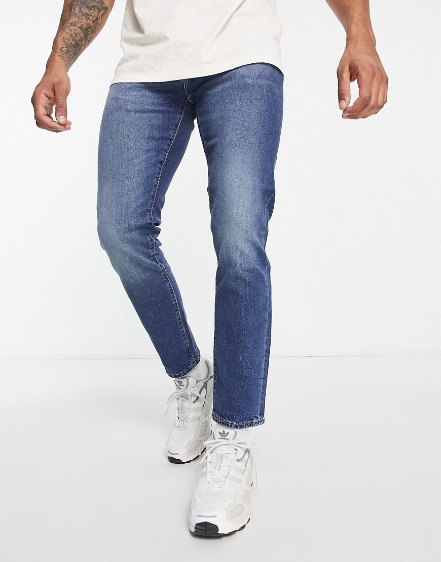 Levi's 512 slim tapered jeans in mid wash blue