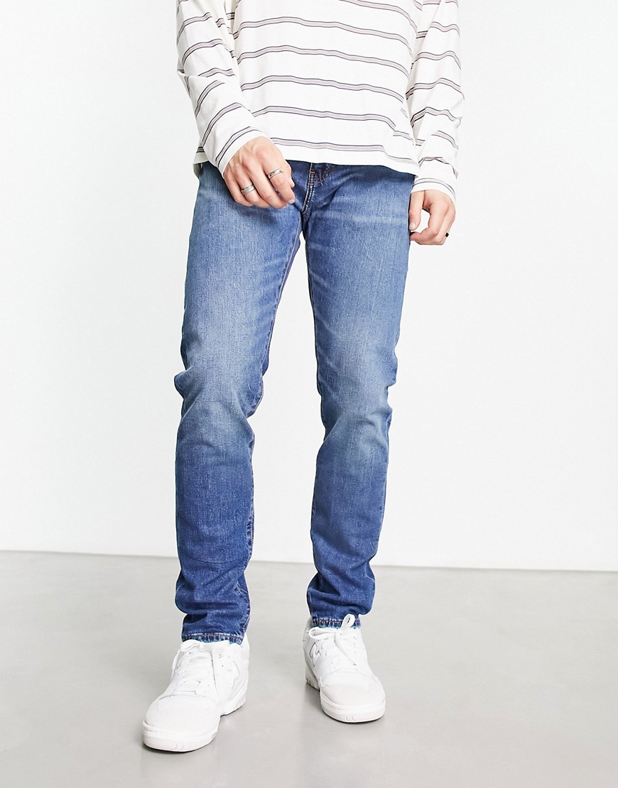 Levi's 512 slim tapered jeans in midwash blue