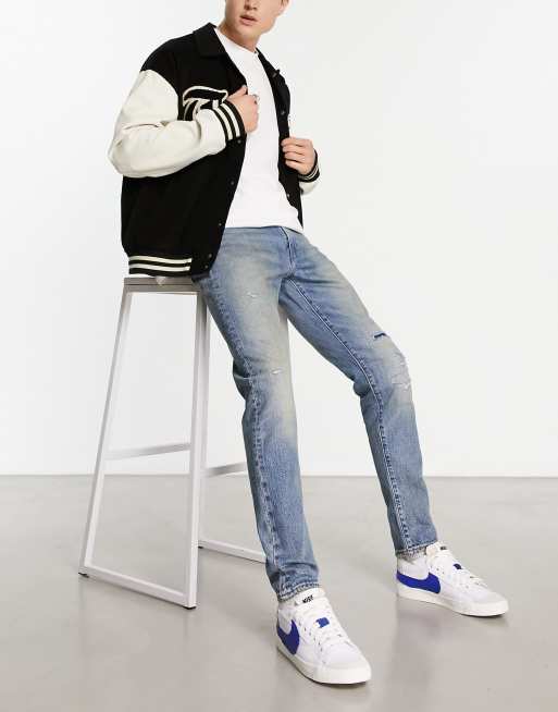Levi's - 512 - Smaltoelopende jeans met slijtageplekken op de knie in vintage blauwe wassing