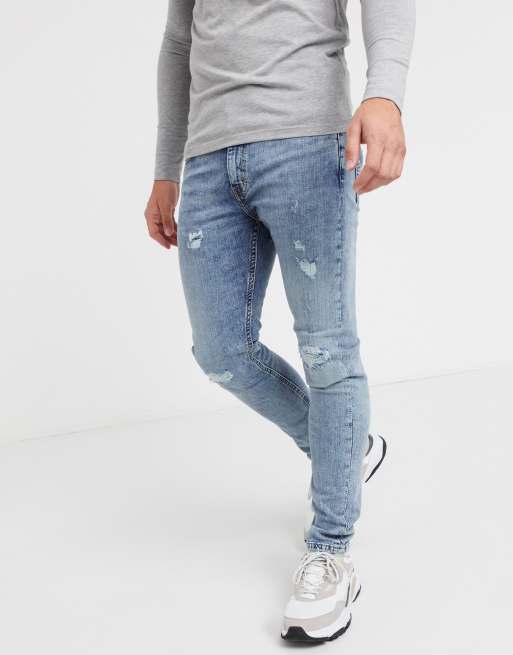 Levi's 519 super skinny Hi-Ball jeans in distressed light wash | ASOS