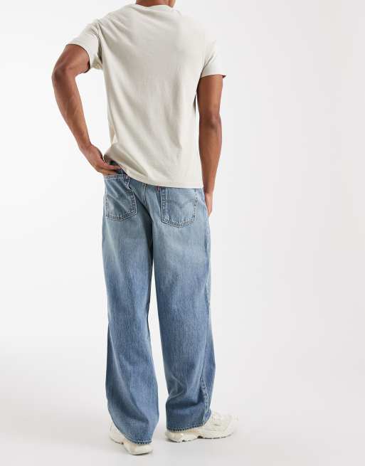 Levi's 578 baggy jeans with ripped knee in mid blue | ASOS