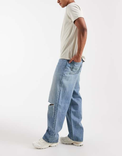 Levi's 578 baggy jeans with ripped knee in mid blue , 3 of 5