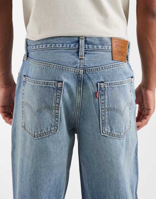 Levi's 578 baggy jeans with ripped knee in mid blue | ASOS