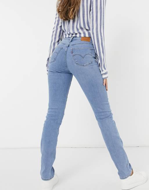 Levi s 724 high rise straight leg jeans in mid wash blue