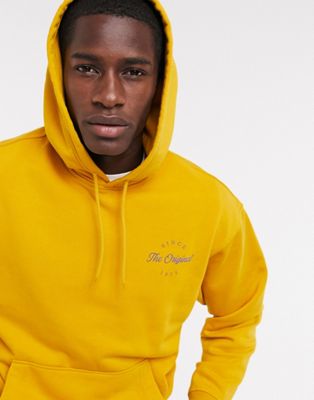 Levi's back print logo relaxed fit fleece hoodie in golden yellow | ASOS