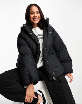Levi's Down Bubble hooded puffer jacket in black with logo - ASOS Price Checker