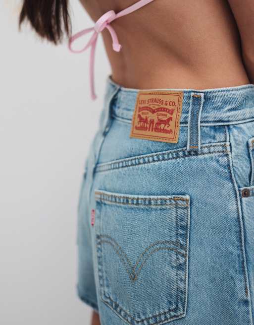 Levi's high waisted distressed denim mom shorts in light blue, 4 of 9