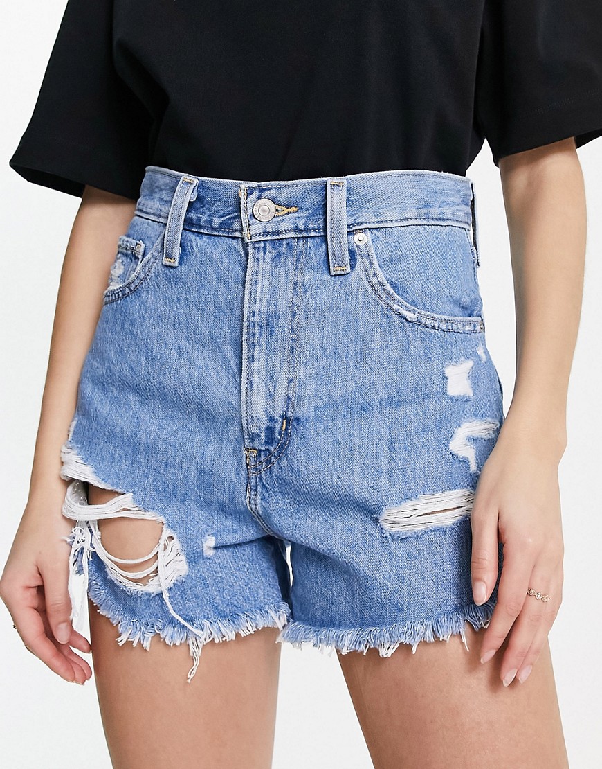 Levi’s high waisted distressed mom shorts in light wash blue