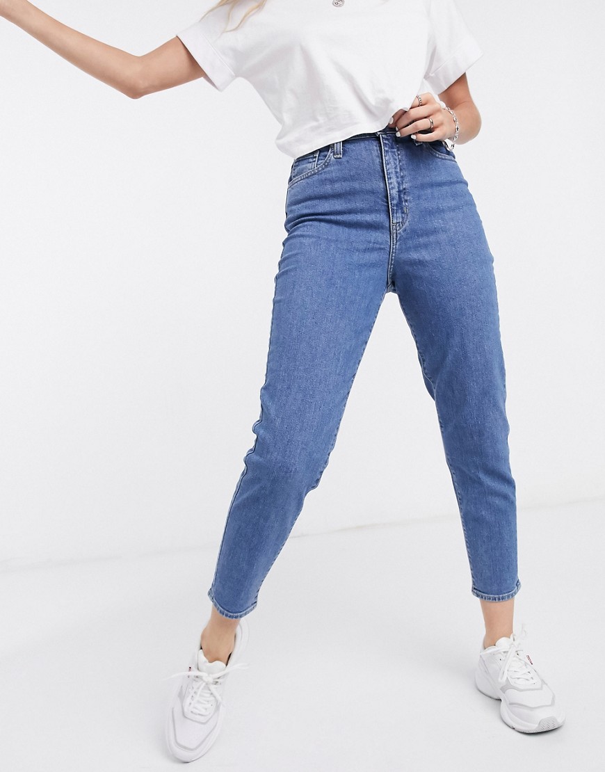 Levi’s high waisted tapered jeans in mid-stone wash-Blue