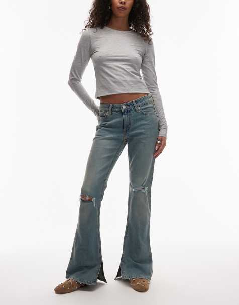 Levi's jeansy denim slim bootcut z niskim stanem i przetarciami na kolanach w jasnoniebieskim kolorze - view 1