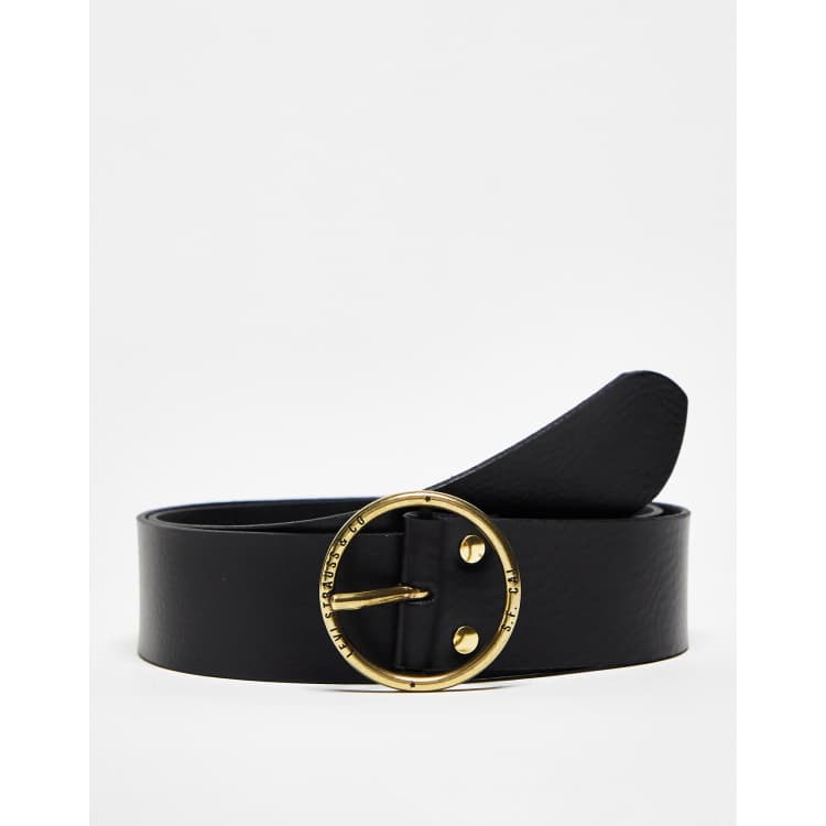 Belt with gold round buckle