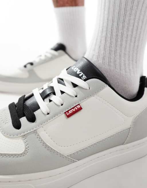 Levi s Liam trainers with red tab logo in white and navy ASOS