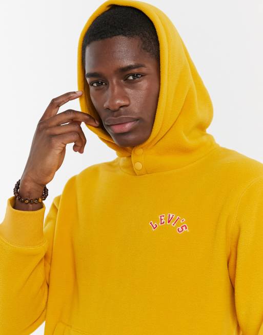 Levi's logo polar fleece hoodie in golden yellow | ASOS