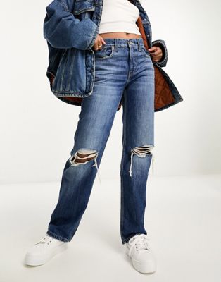 Levi's low rise ripped knee jeans in mid blue - ASOS Price Checker
