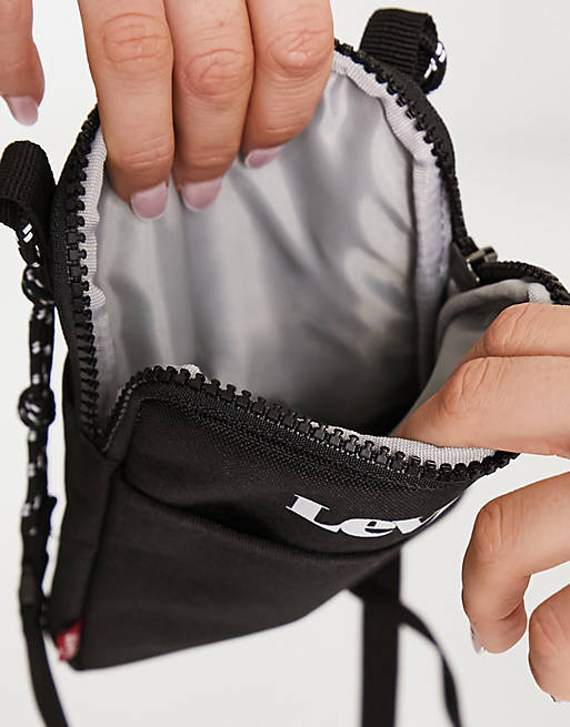 Levi's mini crossbody tech bag in black | ASOS