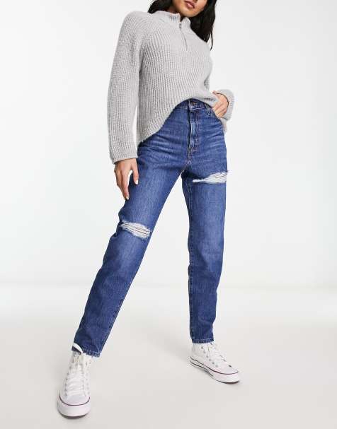 Levi's high waisted mom jeans with rips in mid wash