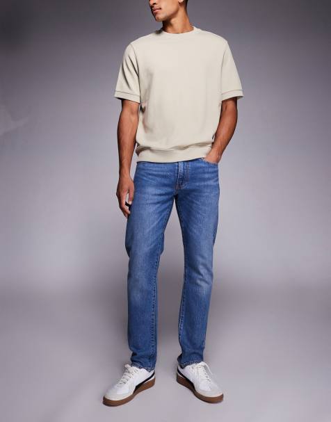 Levi's 502 tapered jeans in mid wash