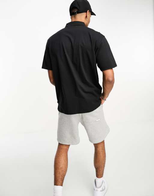 Levi's - Poloshirt van jersey met vintage pasvorm en klein logo in zwart, 2 van 4