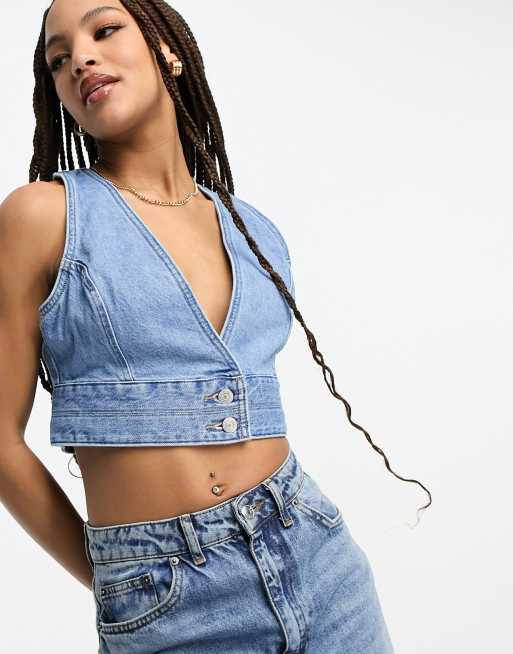 Levi's - Raine - Crop top style corset en jean - Bleu moyen | ASOS