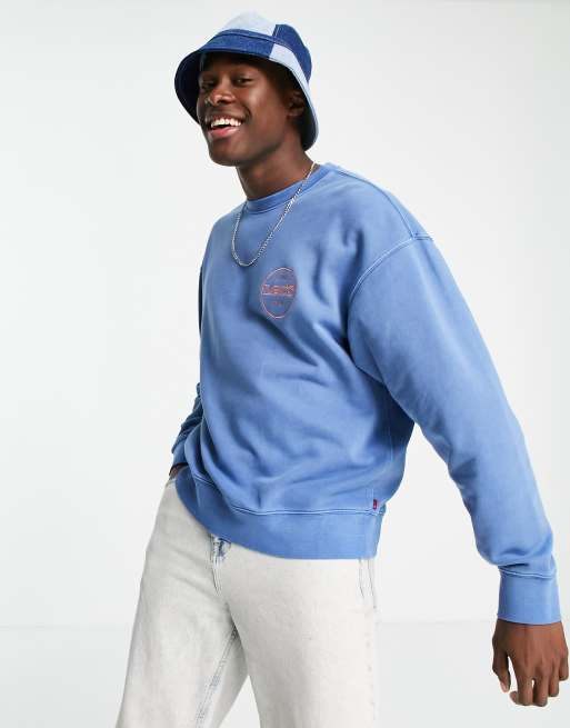 Levi's relaxed fit circle logo sweatshirt in garment dye star sapphire blue  | ASOS