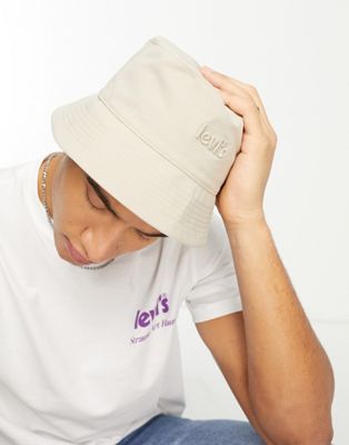 Levi's reversible bucket hat in cream and all over print with poster logo - ASOS Price Checker