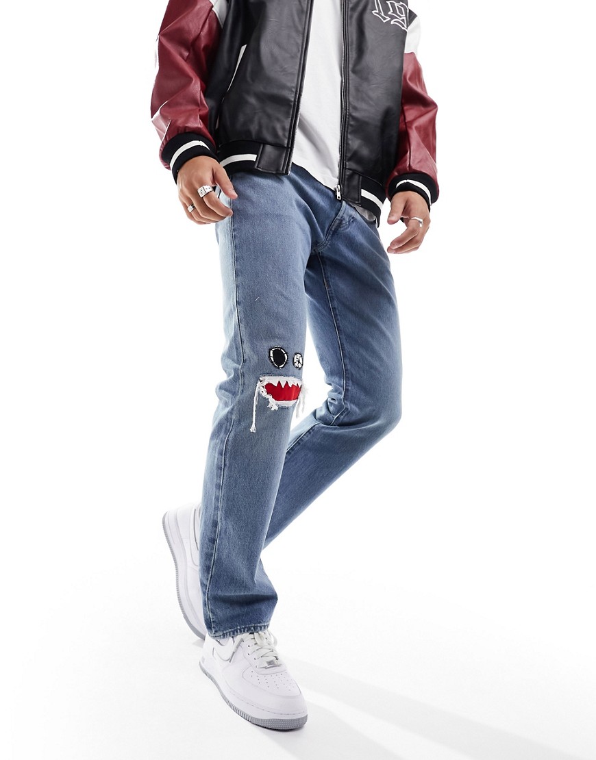 levi's - skate 501 - ljusblå jeans med applikation vid knät