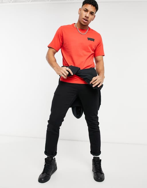 Levi's - Skateboarding - T-shirt rosso papavero con etichetta ad ali di pipistrello nera