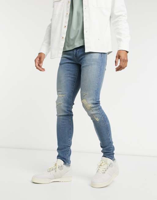 Levi's skinny jeans in distressed dark vintage wash