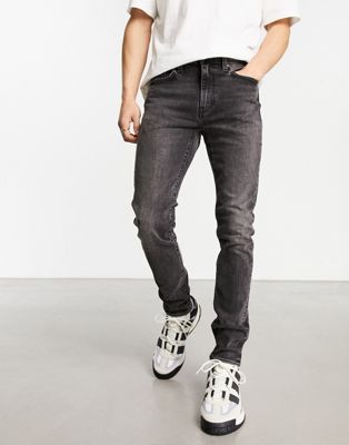 Levi's skinny tapered fit jeans in black with destruction - ASOS Price Checker