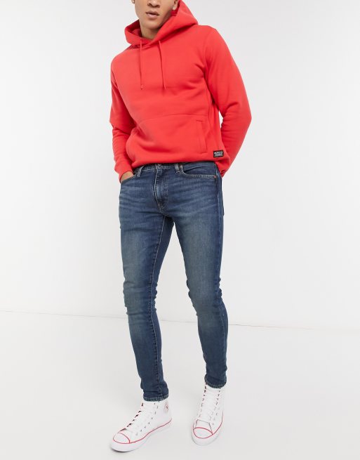 Levi's skinny tapered fit jeans in blue mid wash