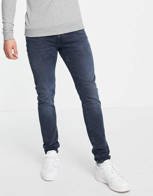 Levi s skinny tapered fit jeans in dark navy overdye