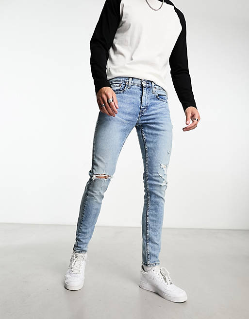 Levi's Skinny tapered fit jeans in light blue wash with distressing | ASOS