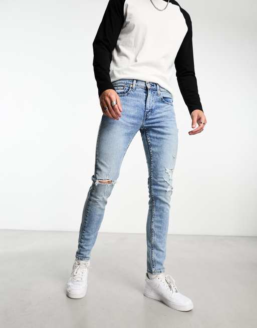 Levi's Skinny tapered fit jeans in light blue wash with distressing | ASOS