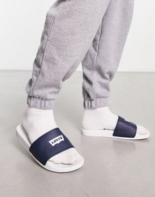 Levi's sliders in white navy with batwing logo