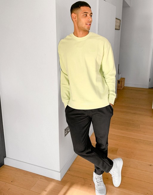 Levi's small logo relaxed fit crewneck sweatshirt in shadow lime