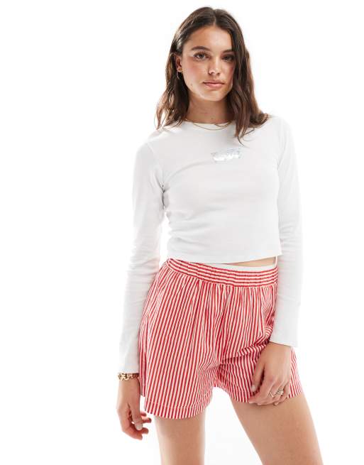 Levi's - T-shirt style sport à manches longues avec logo à pois scintillant - Blanc