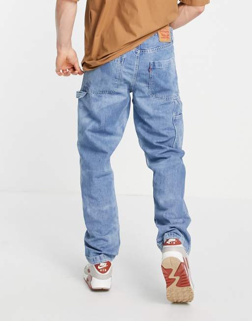 Levi's tapered fit carpenter jeans in mid wash blue