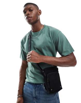 tonal logo small canvas crossbody bag in black