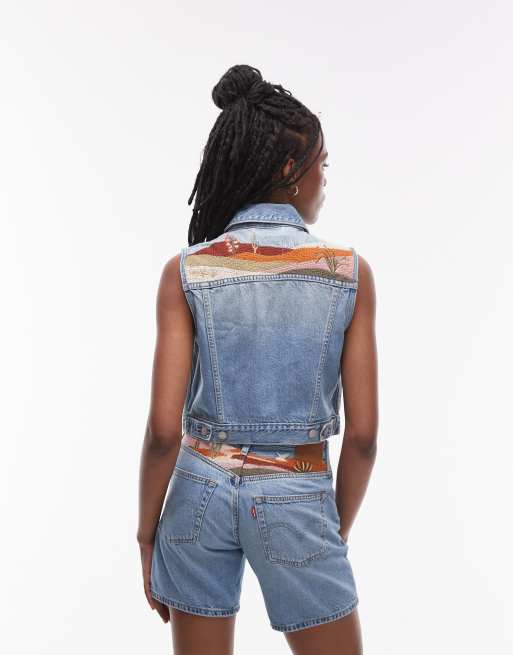T-shirt court crop top bleu ciel à détail fleuri, taille XS (D'occasion