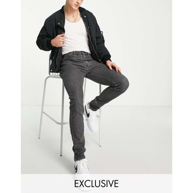 Levi s x ASOS exclusive 512 slim tapered jeans in black wash with knee abraisons