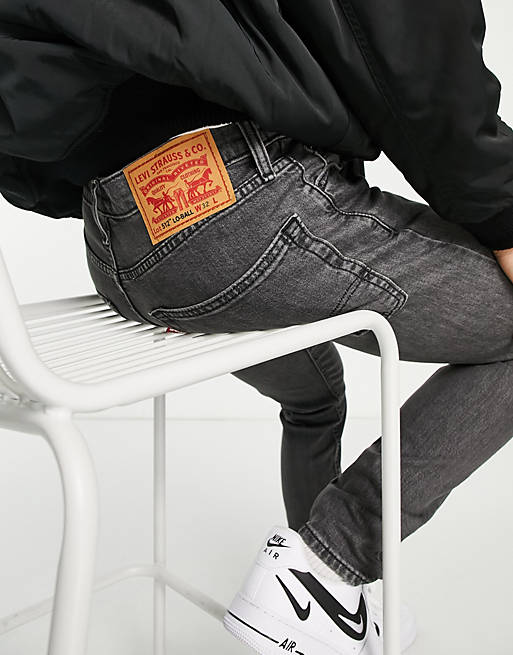 Levi's x ASOS exclusive 512 slim tapered jeans in black wash with knee  abraisons | ASOS