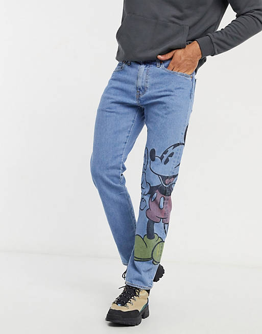 Levi's x Disney jeans with large Mickey Mouse graphic in blue mid wash |  ASOS