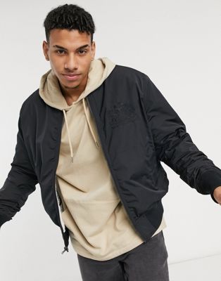 Levi's x Disney reversible quilted bomber jacket in black | ASOS