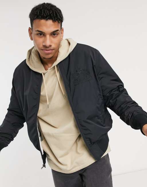 melón adjetivo Brote Levi's x Disney reversible quilted bomber jacket in black | ASOS