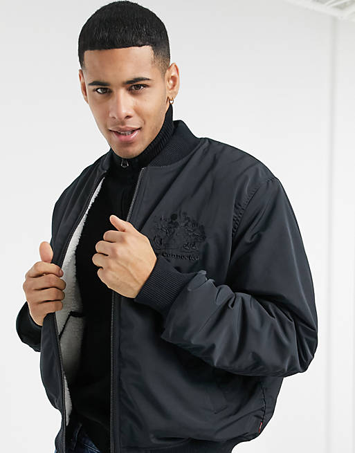 Levi's x Disney reversible trucker jacket in black | ASOS