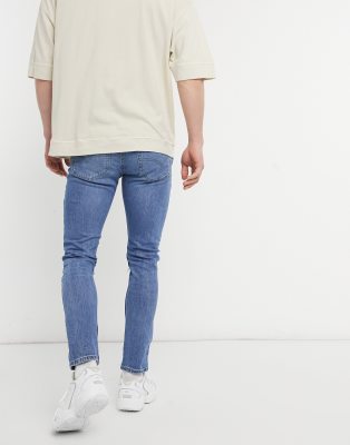 levi's 519 skinny distressed jeans